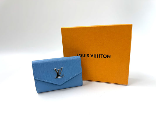 Pre-Owned Louis Vuitton Capucines Compact Wallet in Blue Taurillon Leather with Silver LV Logo