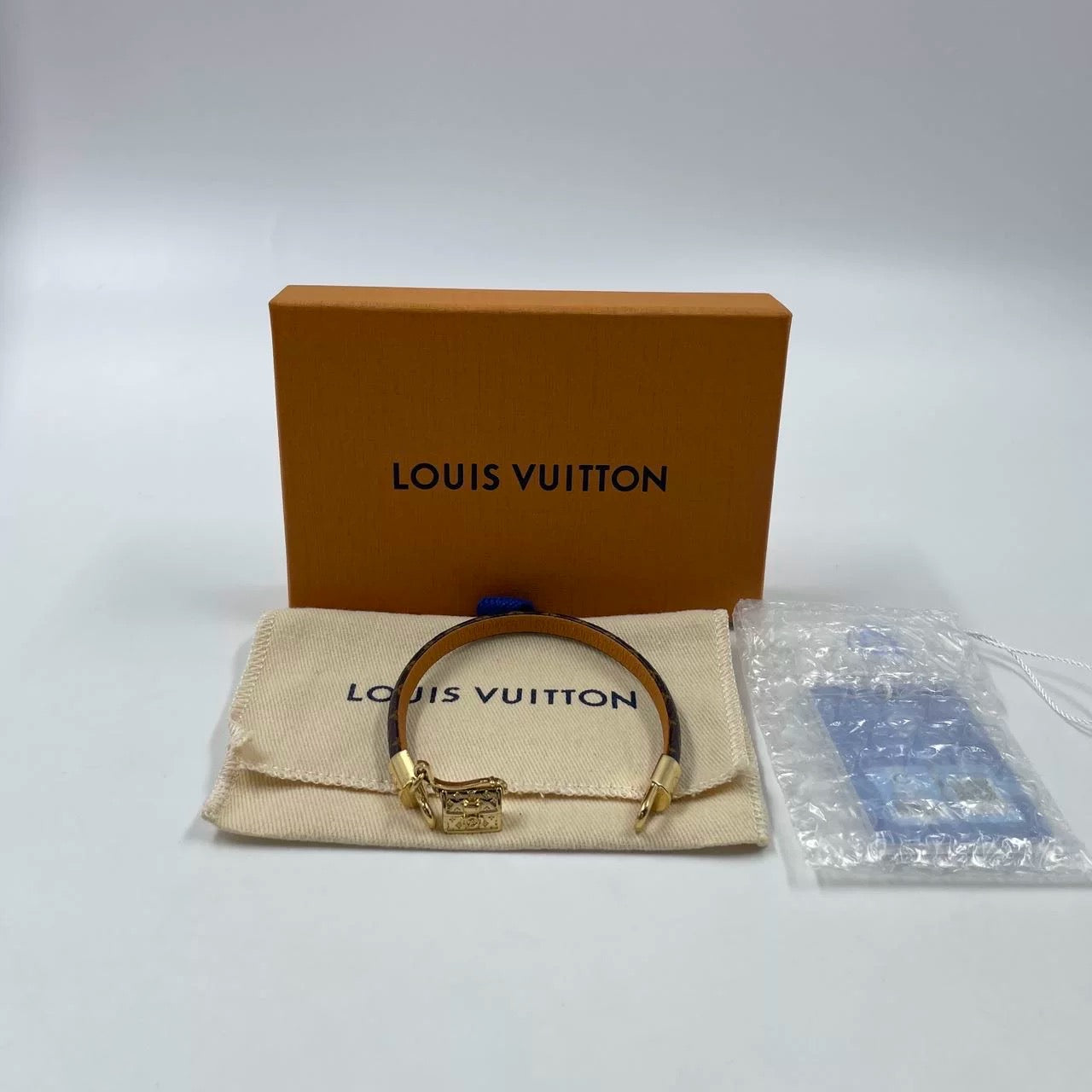 Pre-Owned Louis Vuitton Monogram Bracelet with Gold-Tone Padlock Charm